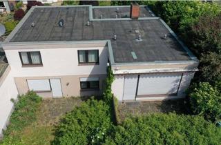 Haus kaufen in 65719 Hofheim am Taunus, Wohnen mit Freiraum – Familienbungalow auf sonnigem XXL-Grundstück in Hofheim-Wallau