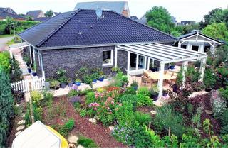 Haus kaufen in 24321 Behrensdorf, Bungalow an der Hohwachter Bucht vereint Ruhe, Natur und Wohnkomfort auf besondere Weise