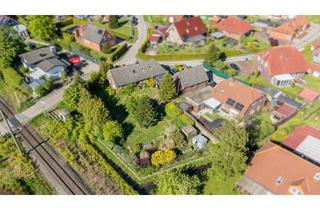 Haus kaufen in 26529 Osteel, Ihr Projekt mit Potenzial: Familienhaus, Garage & Werkstatt bieten viel Raum zur Entfaltung