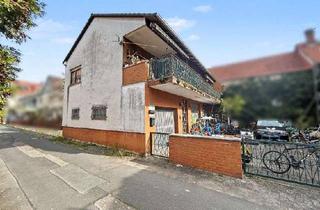 Einfamilienhaus kaufen in 64401 Groß-Bieberau, Vermietetes Einfamilienhaus mit großzügigen Garagen in Groß-Bieberau – attraktive Kapitalanlage