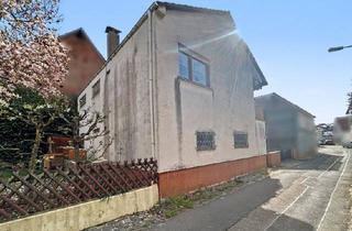 Einfamilienhaus kaufen in 64401 Groß-Bieberau, Vermietetes Einfamilienhaus mit großzügigen Garagen in Groß-Bieberau – attraktive Kapitalanlage