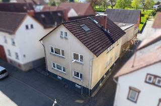 Mehrfamilienhaus kaufen in 35625 Hüttenberg, Solides Mehrfamilienhaus mit Nebengebäude und Scheune auf sonnigem Westgrundstück