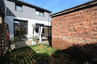 Wohnung kaufen in 64319 Pfungstadt, Neuwertige 2-Zimmerwohnung mit großer Terrasse und eigenem Gartenanteil