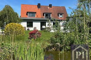 Haus kaufen in 24340 Windeby, Traumhaft gelegenes Zweifamilienhaus mit Weitblick über das Noor – Feldrandlage bei Eckernförde