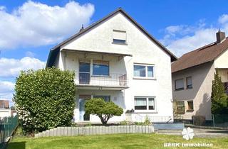 Haus kaufen in 63533 Mainhausen, RESERVIERT - BERK Immobilien - Familienfreundliches Zweifamilienhaus mit sonnigem Grundstück und vie