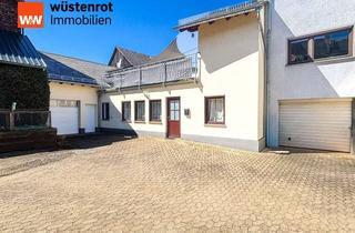 Haus kaufen in 56348 Weisel, Vielseitiges Zweifamilienhaus mit Garage & Doppelgarage in ruhiger Lage von Weisel