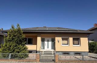 Haus kaufen in 68647 Biblis, Stilvoller Bungalow mit schönem Garten