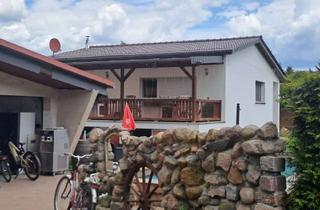 Einfamilienhaus kaufen in 16831 Rheinsberg, Einfamilienhaus im Bungalowstil mit Nebengebäuden und weiterem Baupotential in Rheinsberg...