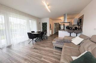 Wohnung kaufen in 47475 Kamp-Lintfort, Moderne Erdgeschosswohnung mit überdachter Terrasse und Garten