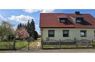 Doppelhaushälfte kaufen in Dimitroffstraße 25, 06803 Bitterfeld-Wolfen, Charmante Doppelhaushälfte mit großem Grundstück, Garage & Werkstatt in ruhiger Wohnlage
