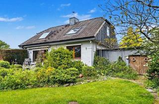 Haus kaufen in 24598 Heidmühlen, Kleiner Bungalow mit großem Studio im Dachgeschoss und wohnlichem Vollkeller mit Bad in Heidmühlen