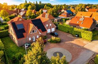 Einfamilienhaus kaufen in 26529 Upgant-Schott, Großzügiges Einfamilienhaus mit ELW, Doppelgarage und pflegeleichtem Grundstück