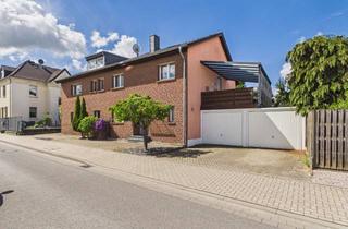 Haus kaufen in Flemmingstraße 52-54, 52372 Kreuzau, Attraktives Zweifamilienhaus in ruhiger Wohnlage mit Terrasse und Garagen