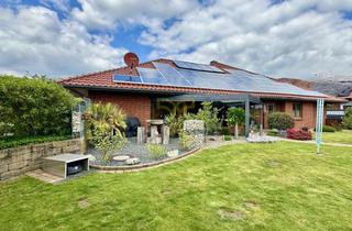 Haus kaufen in 29399 Wahrenholz, Exklusiver Walmdachbungalow mit lichtdurchflutetem Wohnambiente und Poollandschaft