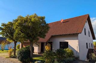 Einfamilienhaus kaufen in 97947 Grünsfeld, Grünsfeld - Geräumiges Familienhaus mit vermieteter Einliegerwohnung