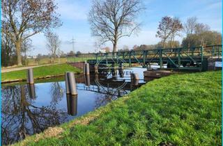 Einfamilienhaus kaufen in 26452 Sande, Leben am Wasser: Freistehendes Einfamilienhaus in idyllischer Kanallage von Sande