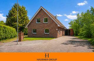 Einfamilienhaus kaufen in 26676 Barßel, Seltene Lage am Kanal - Einfamilienhaus mit 4 Zimmern, Garten und Kamin!