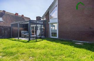 Einfamilienhaus kaufen in 49635 Badbergen, Großzügiges, modernisiertes Wohnhaus mit Halle auf weitläufigem Eckgrundstück