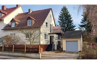 Haus kaufen in An Der Kurhessenhalle 14, 34134 Niederzwehren, Zweifamilienhaus in Kassel-Niederzwehren mit Garten und Baugrundstück