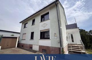 Haus kaufen in 66450 Bexbach, Attraktives Anlageobjekt: Gepflegtes Dreifamilienhaus mit Garagen und 957 m² Grundstück