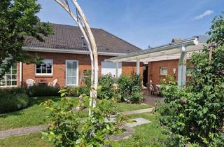 Haus kaufen in 23968 Hohenkirchen, Offenes Wohnen in seiner schönsten Form – Bungalow mit Wintergarten und Wohlfühlgarten