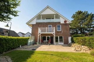 Wohnung kaufen in 23683 Scharbeutz, Wohnen im Grünen: Wunderschöne Erdgeschosswohnung mit Südterrasse und Gartenidylle in Scharbeutz