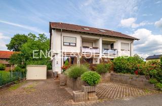 Wohnung kaufen in 65474 Bischofsheim, Sonnendurchflutete Maisonettewohnung in charmanter Doppelhaushälfte mit Terrasse und zwei Bädern