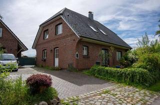 Einfamilienhaus kaufen in 25335 Neuendorf, Familientraum am Elbdeich: Massives Einfamilienhaus mit Garagenhaus, Sauna, Kamin und Südgarten
