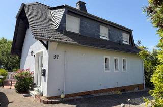 Einfamilienhaus kaufen in 65366 Geisenheim, Freistehendes Einfamilienhaus mit schön angelegtem Grundstück und Garage