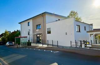 Wohnung kaufen in 49324 Melle, Stilvoll wohnen in moderner Eigentumswohnung mit Garten in gepflegtem Mehrfamilienhaus