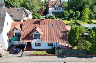Haus kaufen in 37697 Lauenförde, Lauenförde - Geräumiges Architektenhaus: Wellnessbereich, Kachelofen & Garten
