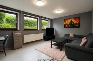 Wohnung kaufen in 79238 Ehrenkirchen, Modernisierte Souterrainwohnung mit Gartenanteil in ruhiger Wohnlage