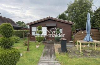 Haus kaufen in Stedener Forst 6, 27729 Holste, schönes Blockbohlenhaus am Stedener See