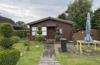 Haus kaufen in Stedener Forst, 27729 Holste, schönes Blockbohlenhaus am Stedener See