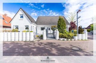 Einfamilienhaus kaufen in 26723 Larrelt, Larrelt! Einfamilienhaus mit drei Wohnungen, Terrasse und Gartenanlage!
