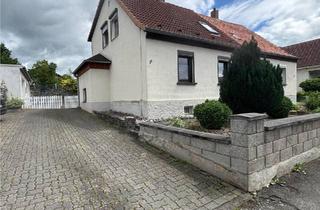 Doppelhaushälfte kaufen in 37581 Bad Gandersheim, Bad Gandersheim - Doppelhaushälfte mit großem Grundstück u. 2 Garagen