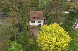 Einfamilienhaus kaufen in 21149 Hausbruch, Sanierungsbedürftiges Einfamilienhaus auf großzügigem Grundstück in idyllischer Hanglage