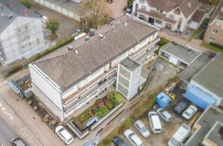 Mehrfamilienhaus kaufen in 52134 Herzogenrath, Herzogenrath - Modernisiertes Niedrigenergiehaus mit 11 Parteien, Garagen und Stellplätzen im Herzen von Kohlscheid