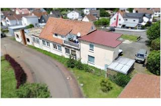 Anlageobjekt in 35321 Laubach, Vielseitiges Anlageobjekt: Vermietete Wohneinheiten & ausbaufähige Gewerbehalle
