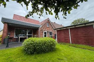Einfamilienhaus kaufen in 26969 Butjadingen, Butjadingen - Charmantes Einfamilienhaus mit Garage, Carport und großem Garten