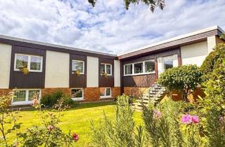 Haus kaufen in 64569 Nauheim, Familientraum: Modernisierter Bungalow auf großem Eckgrundstück mit Einliegerwohnung