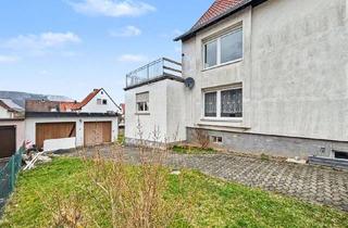Mehrfamilienhaus kaufen in 36266 Heringen, Mehrfamilienhaus mit drei Wohneinheiten, Garagen und Ausbaupotenzial in Leimbach