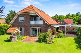 Einfamilienhaus kaufen in 26524 Hage, Hage: Großzügiges Einfamilienhaus mit vermieteter ELW, Doppelcarport und Wohnmobil-Stellplatz