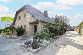 Haus kaufen in 33378 Rheda-Wiedenbrück, Preissenkung! Exklusives EFH mit Bruchsteinfassade,Carport und PV-Anlage in guter Lage von Rheda