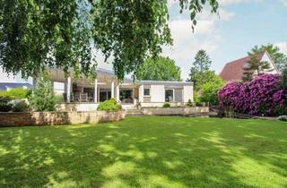 Haus kaufen in 27751 Delmenhorst, Delmenhorst - Beispielloser Bungalow mit traumhaften Garten, Teich und Pavillon mit Outdoor-Küche