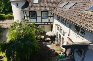 Wohnung kaufen in 65396 Walluf, Eigentumswohnung mit großem Grundstück in idyllischer Grünlage von Walluf