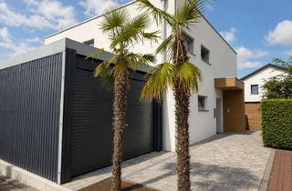 Haus kaufen in 61130 Nidderau, Modernes Architektenhaus mit Caport und exklusivem Wohnkomfortin Nidderau-Heldenbergen