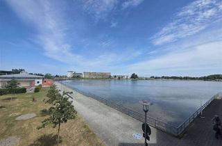 Wohnung kaufen in 23774 Heiligenhafen, Große Ferienwohnung in besonderer Lage mit Binnensee- und Ostseeblick!