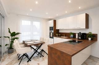 Wohnung kaufen in 88521 Ertingen, Neuwertige Erdgeschosswohnung mit exklusiver Ausstattung und Gartenanteil
