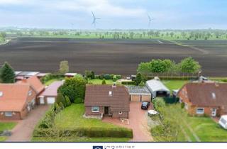 Einfamilienhaus kaufen in 26624 Südbrookmerland, Freistehendes Einfamilienhaus mit Weitblick ins Grüne – Ruhige Lage in Südbrookmerland